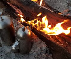 Early morning coffee on a rustic campfire