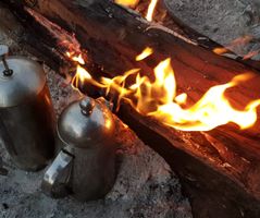 Early morning coffee on a rustic campfire